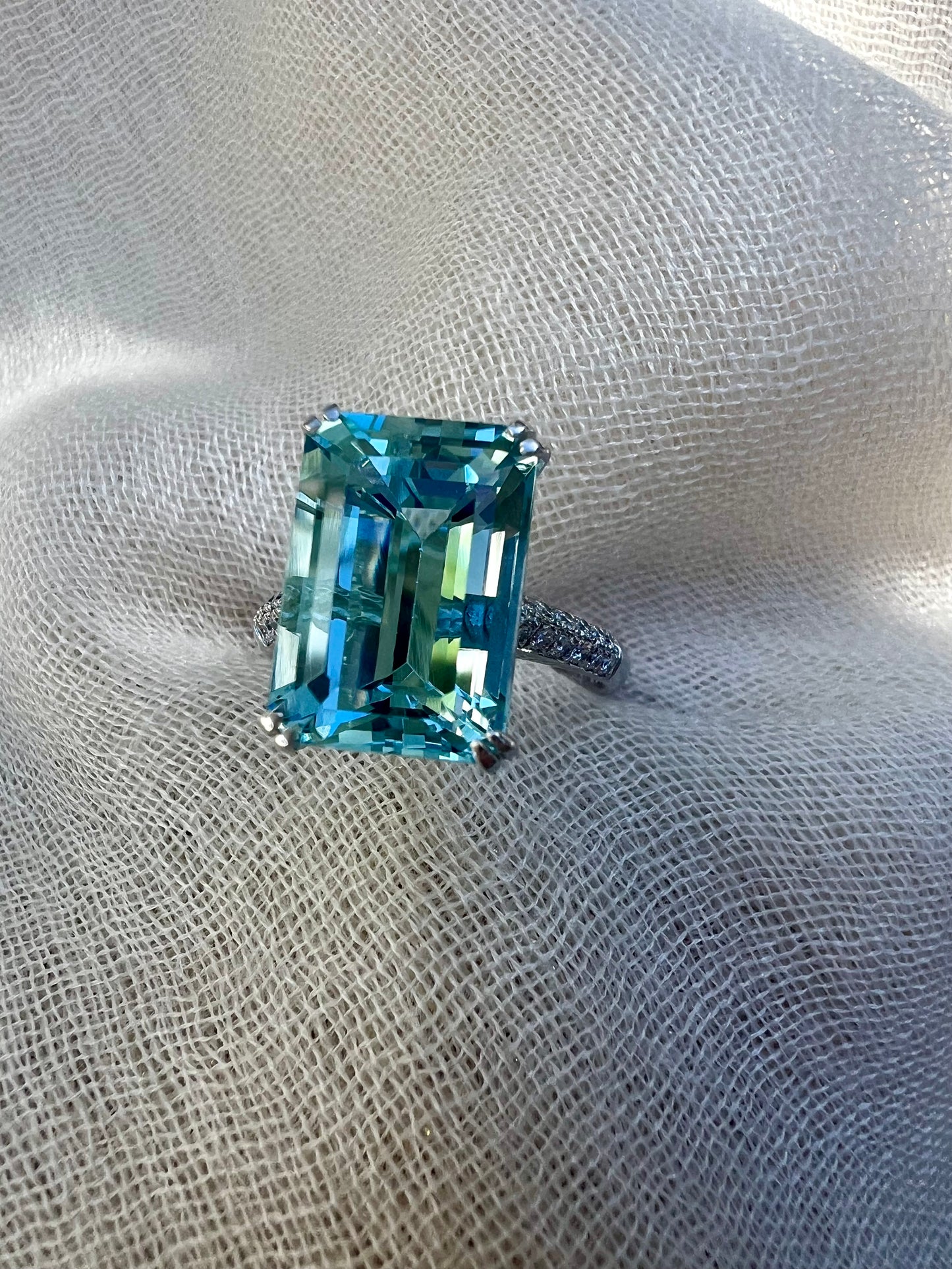 Aquamarine Emerald cut ring in white gold.