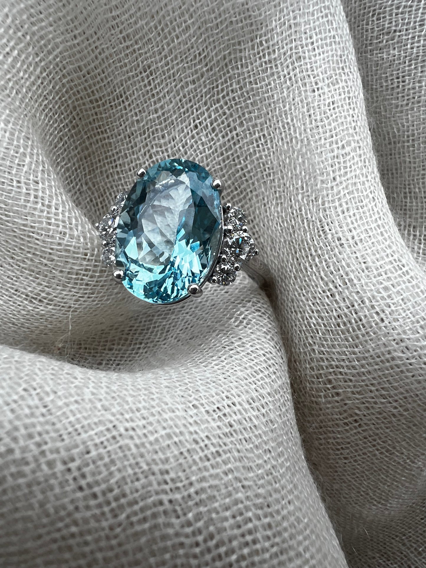Cushion cut Aquamarine split shank ring in white gold.
