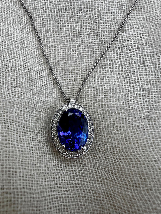 Oval Tanzanite pendant with Halo of Diamonds.