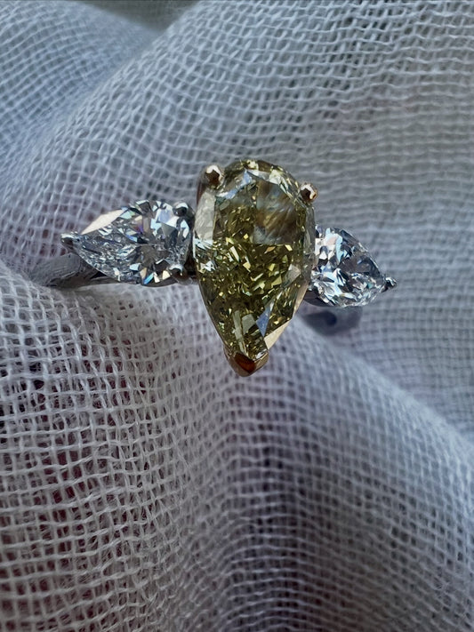 Fancy Yellow Pear Diamond ring with side Pear Diamonds