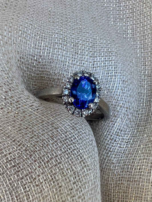 Tanzanite ring with halo of diamonds.
