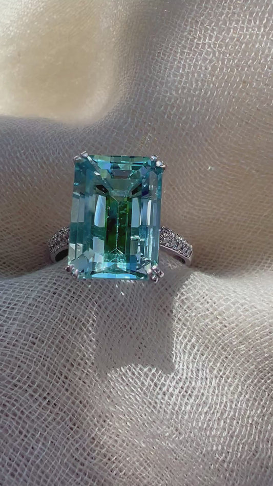 Aquamarine Emerald cut ring in white gold.